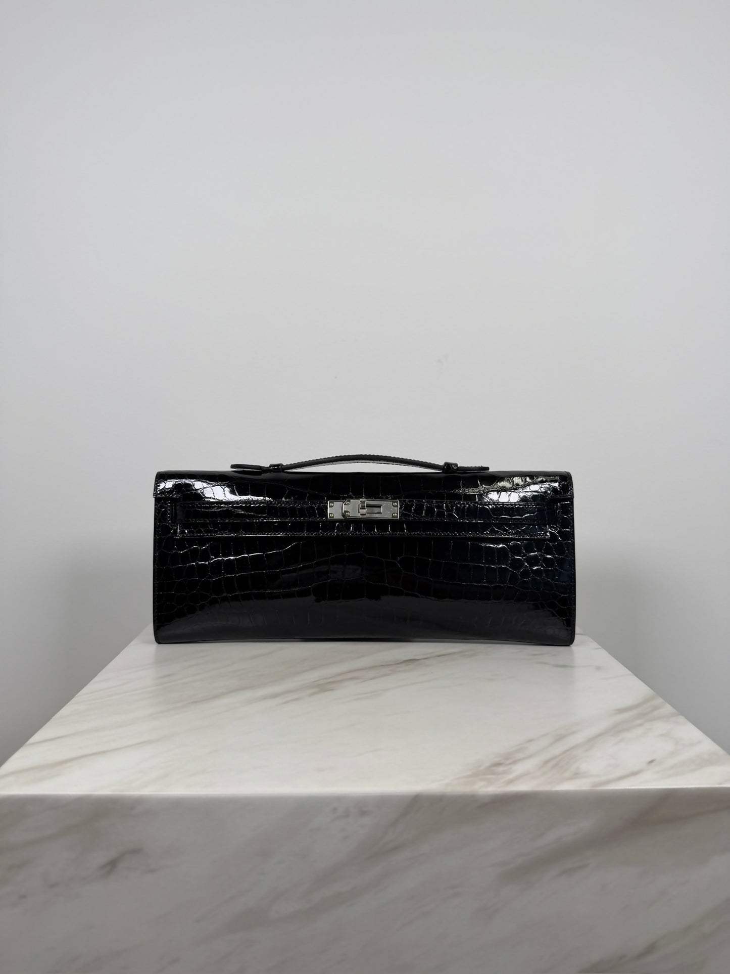 Hermès Kelly Cut Black Shiny Porosus PHW K 2026