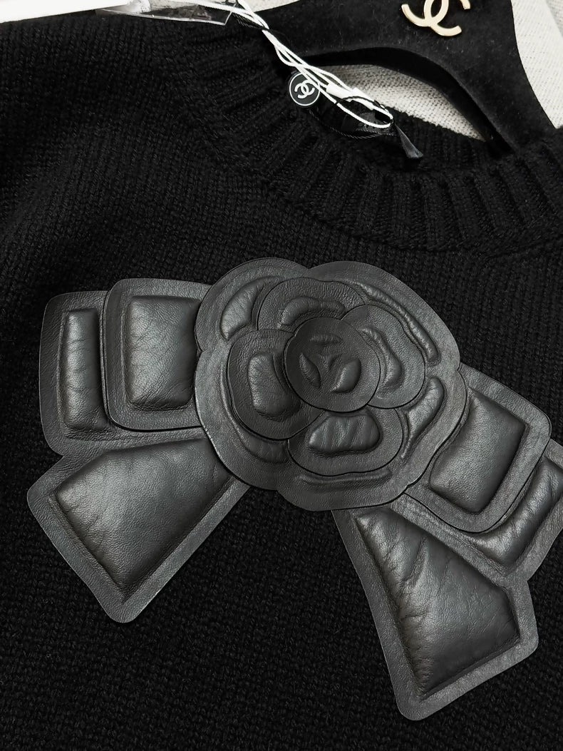 Chanel 20k black leather camellia bow knit top