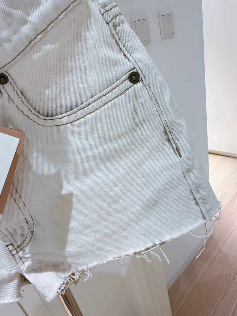 Miu Miu white distressed denim shorts
