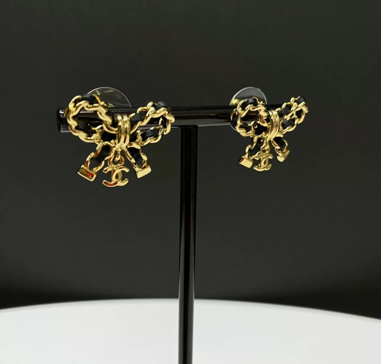 Chanel 25 bow leather chain double C earrings
