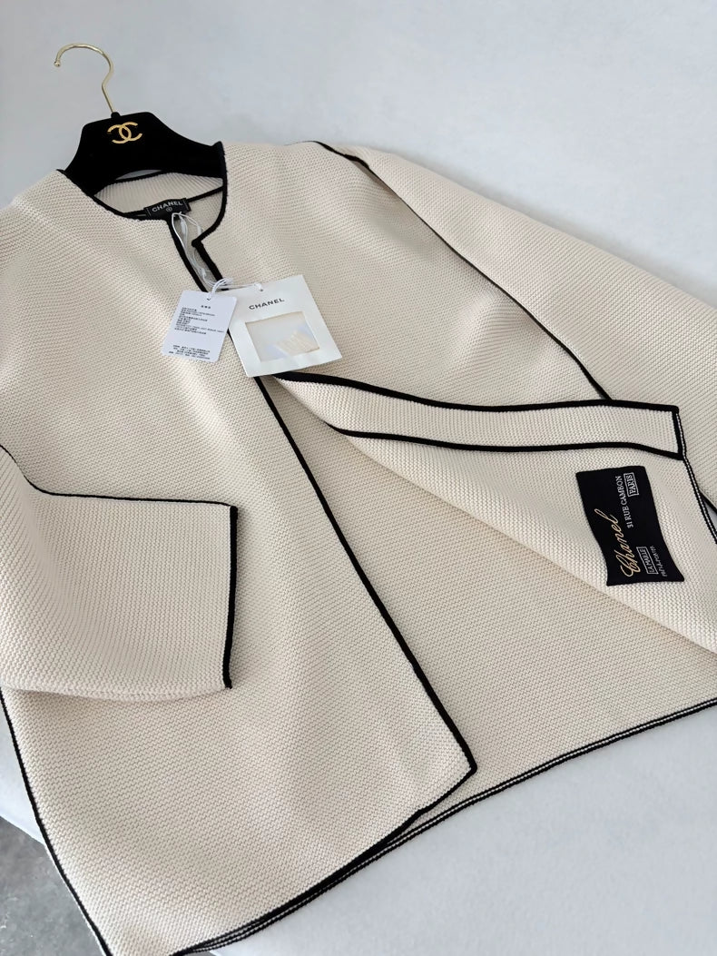 Chanel 26S off-white knit cardigan with black trim – Wararni.com