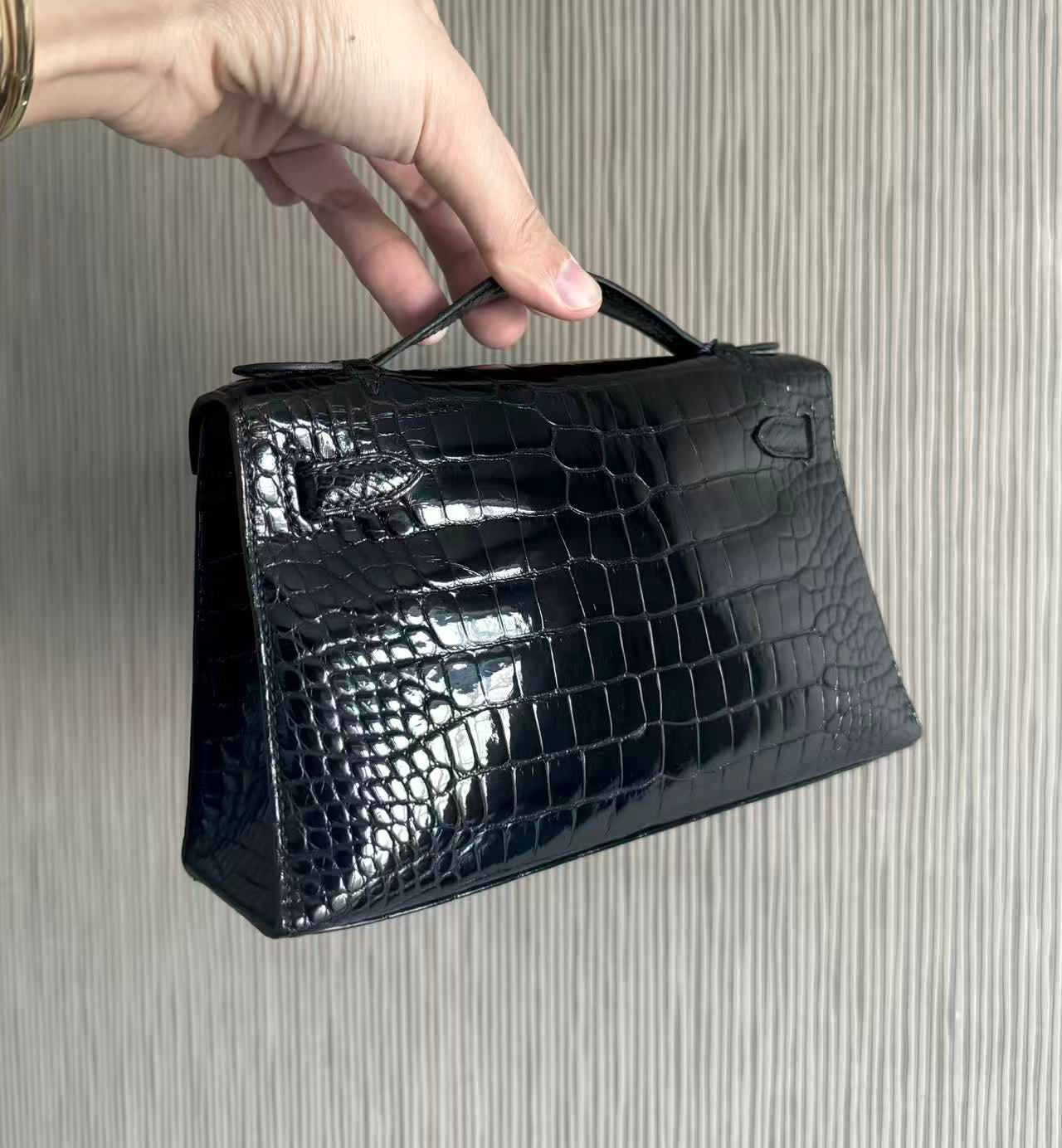 Hermès kelly Pochette Black Shiny crocodile leather palladium hardware
