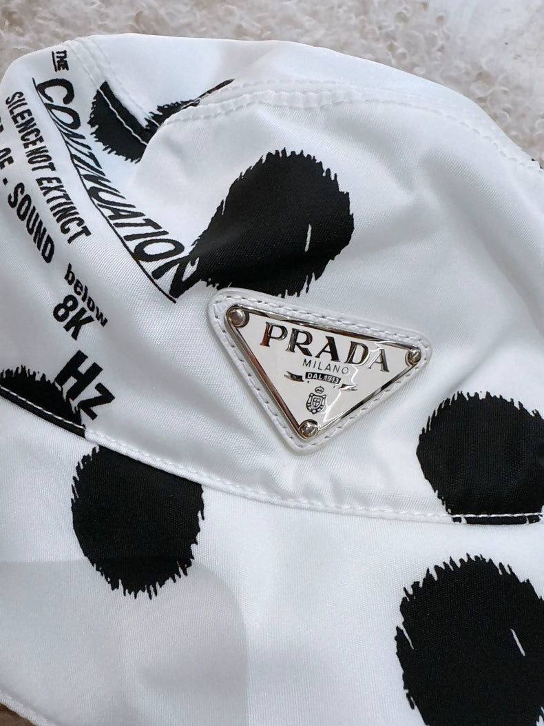 Prada black and white polka dot bucket hat with triangular logo
