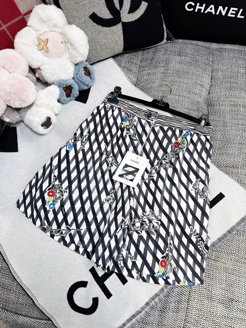 Chanel 26P black quilted silk floral shorts