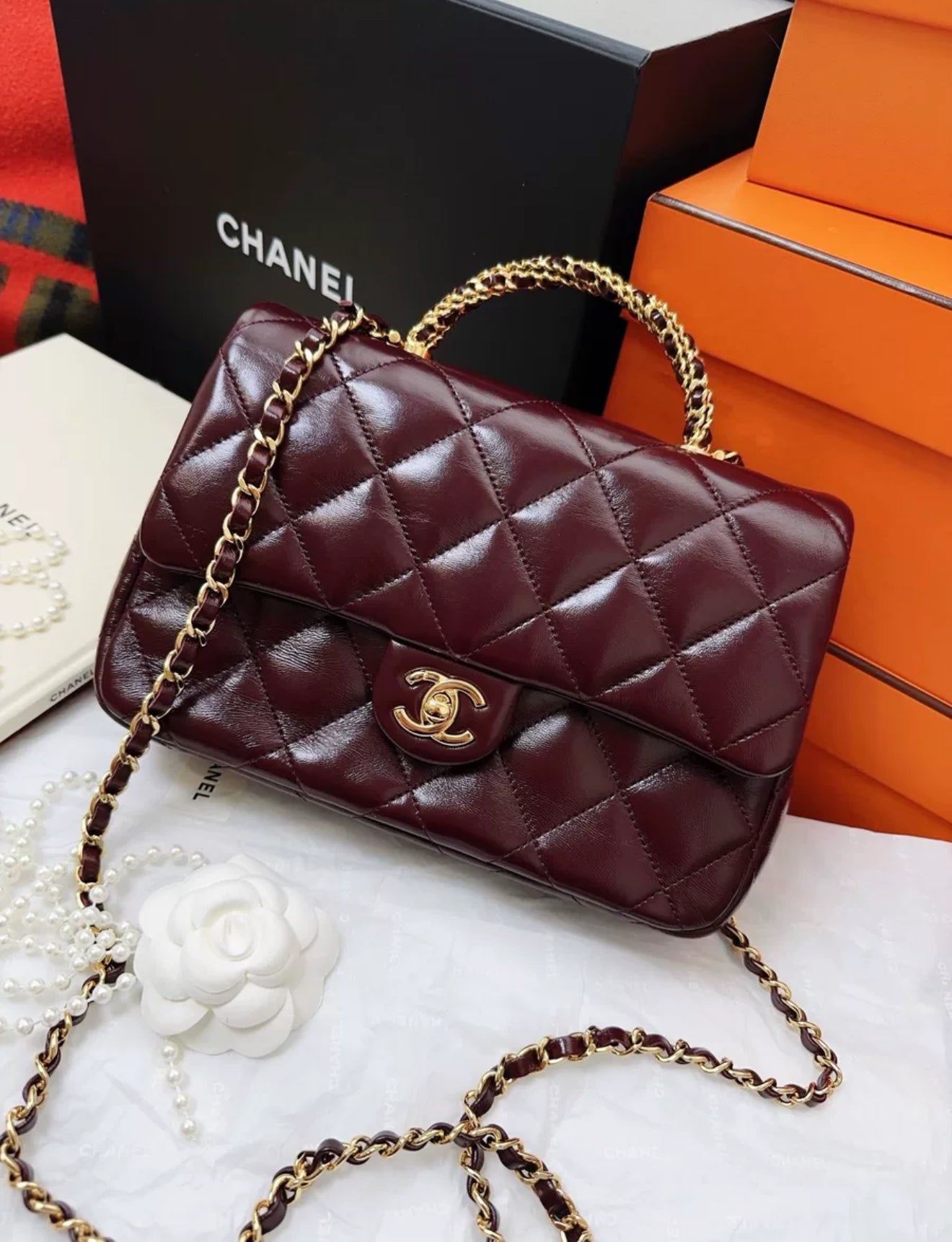 Chanel 24b burgundy sheepskin leather with gold chain top handle