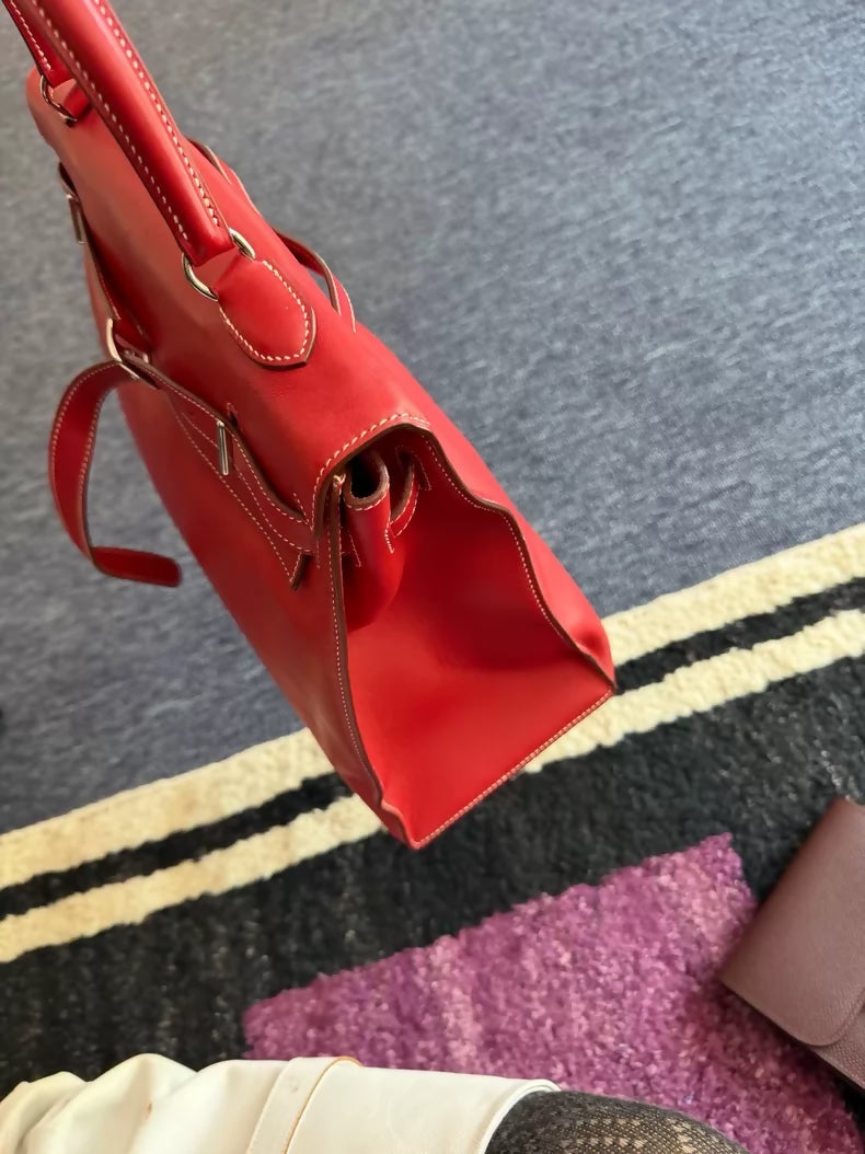 Hermes Flat Kelly 35 in red with white stitching.
