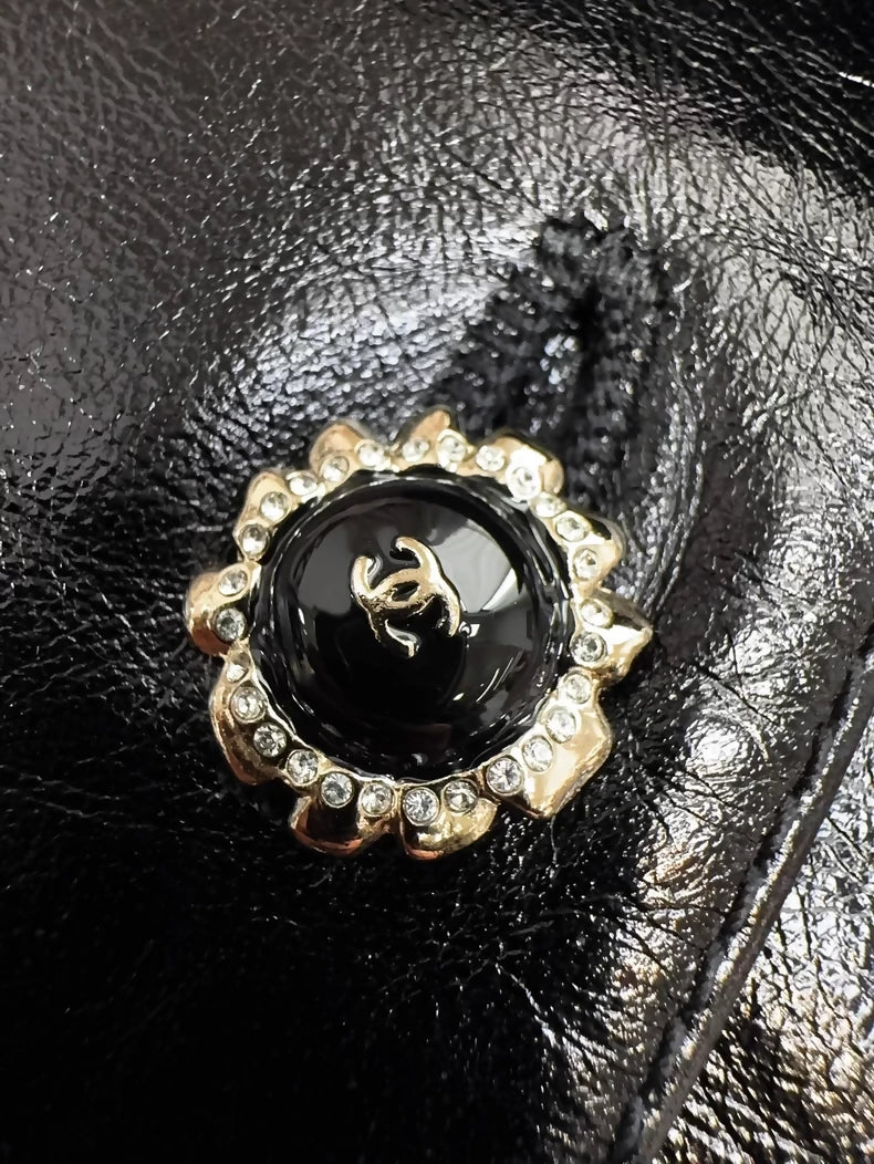 Chanel 25K black leather vest with bow and ruffled collar