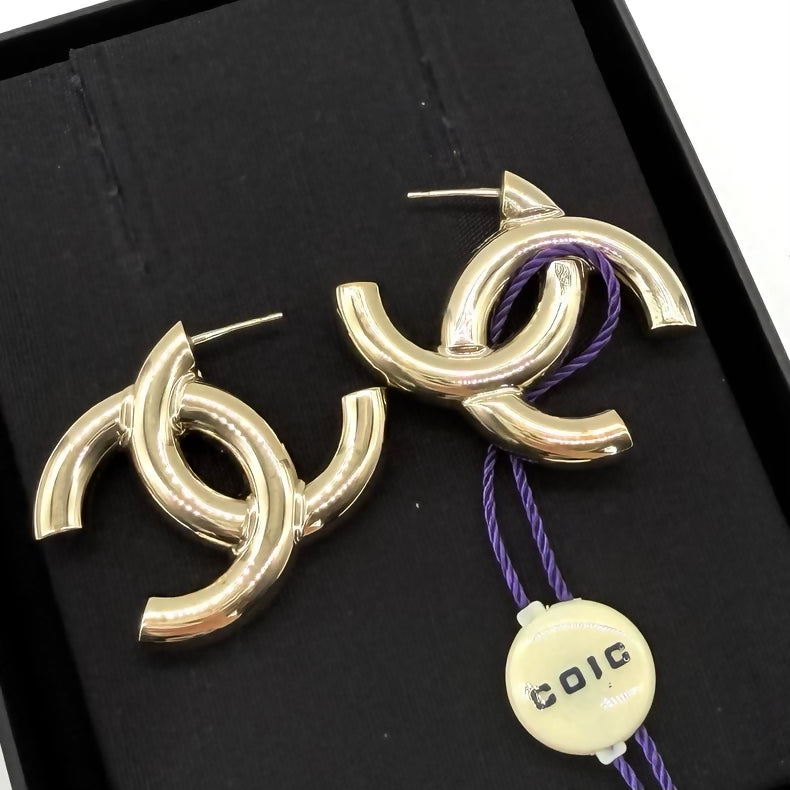 Chanel gold double C side stud earrings
