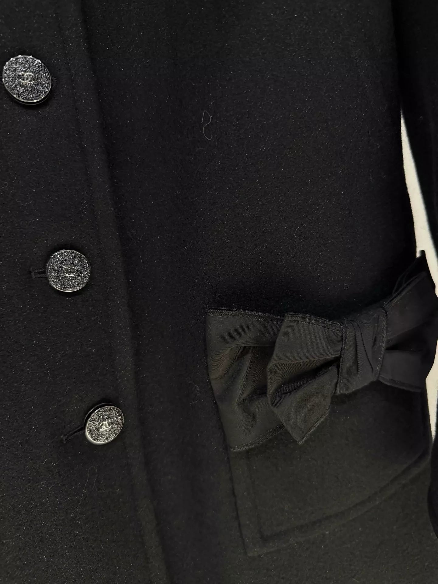 Chanel 24B black coat with bow pocket
