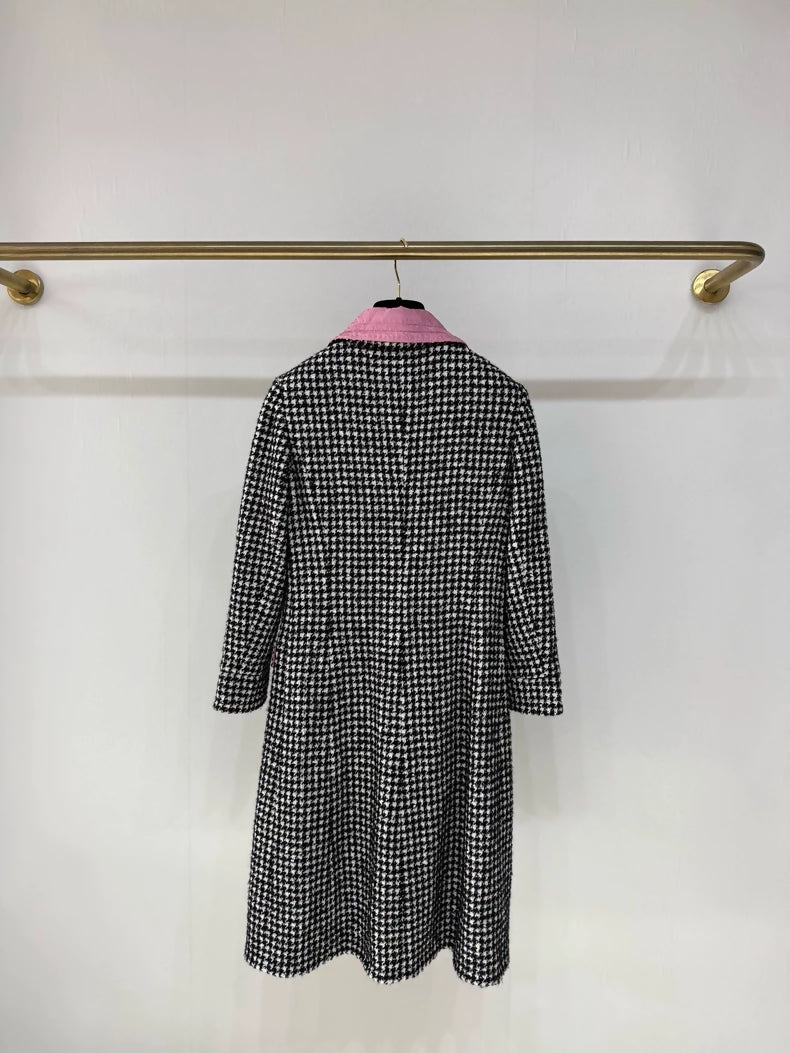 Chanel 24A long coat with black and white houndstooth pattern and pink silk lining