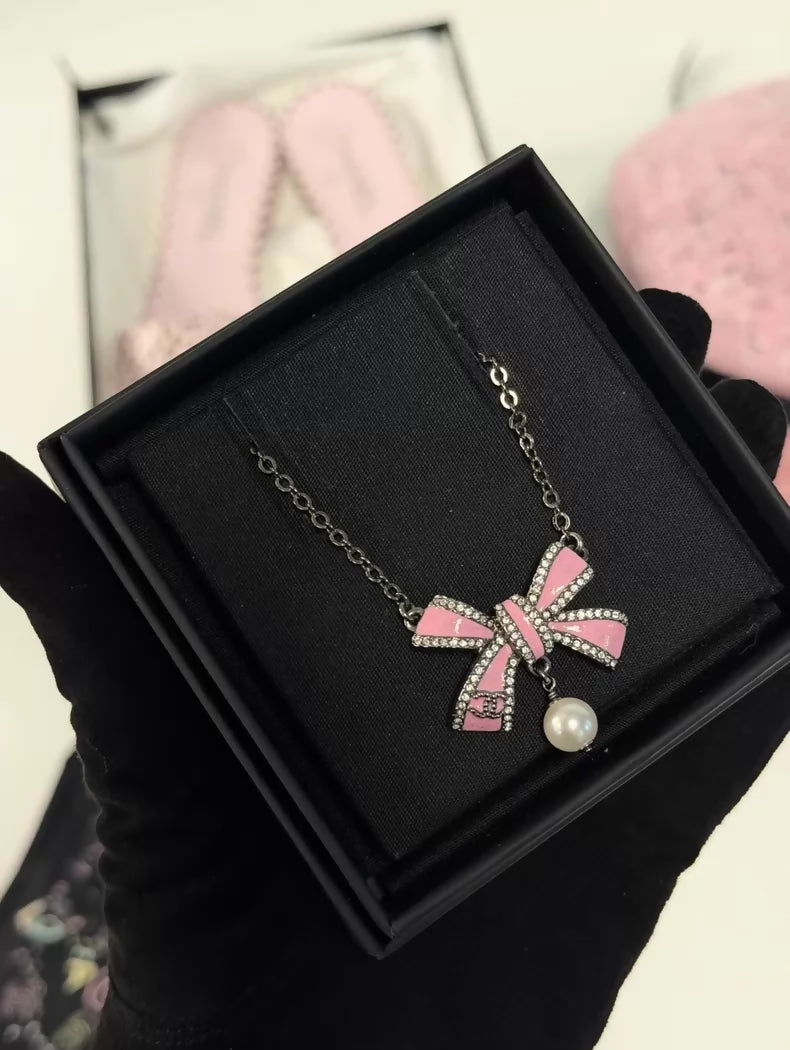 Chanel 25B pink bow pearl necklace