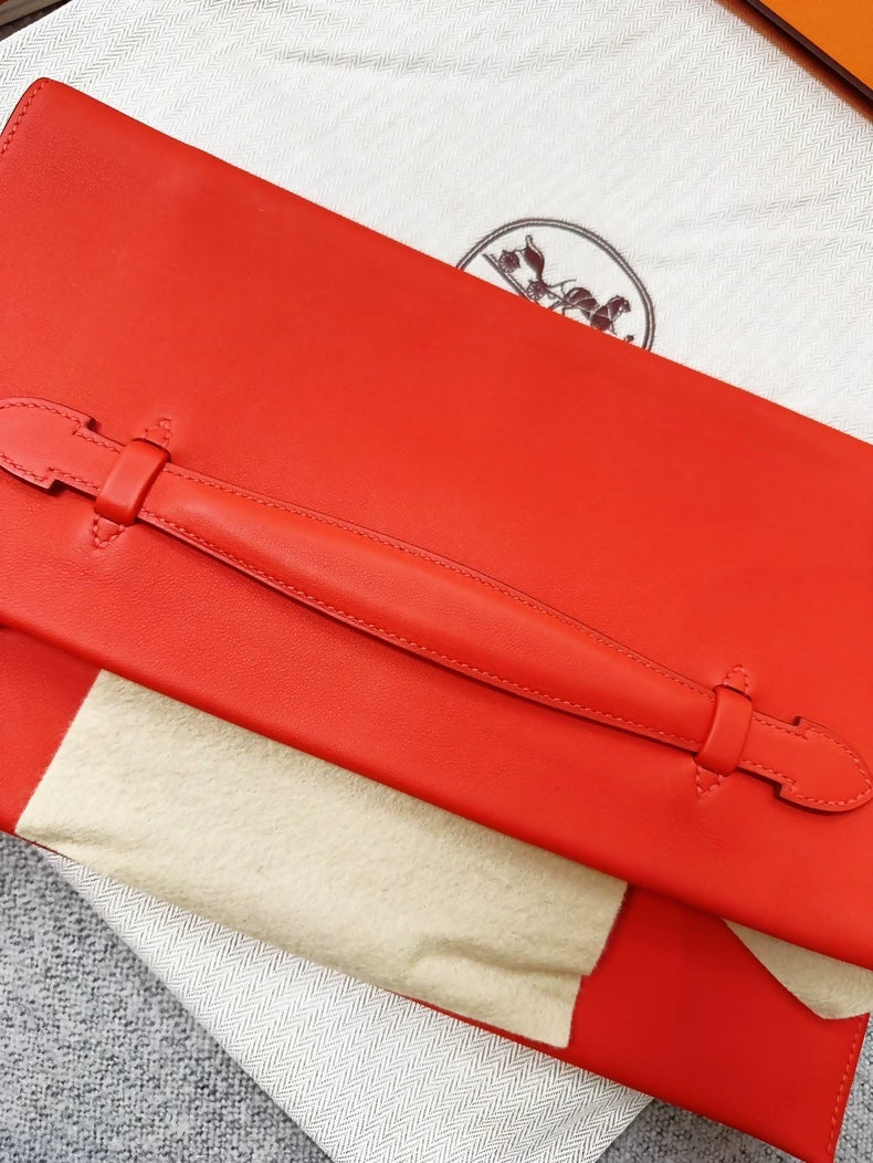 Hermes Pochette Pliplat red clutch