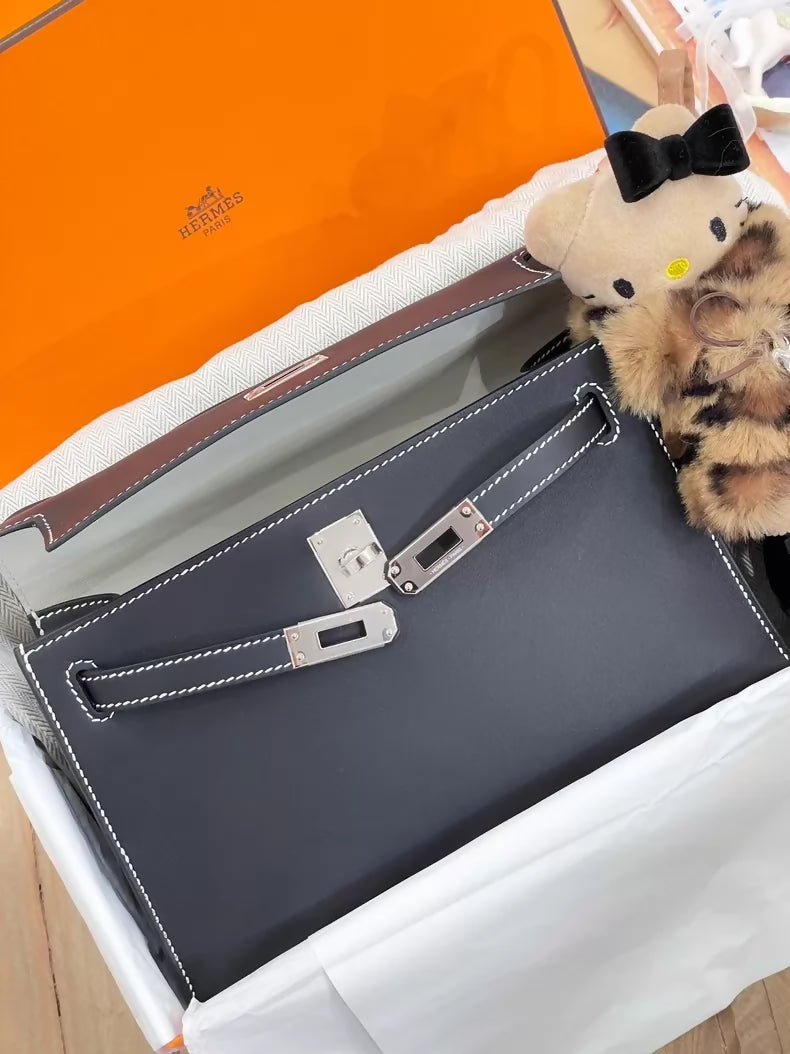 Hermès Kelly Pochette Black Swift leather with white stitching palladium hardware