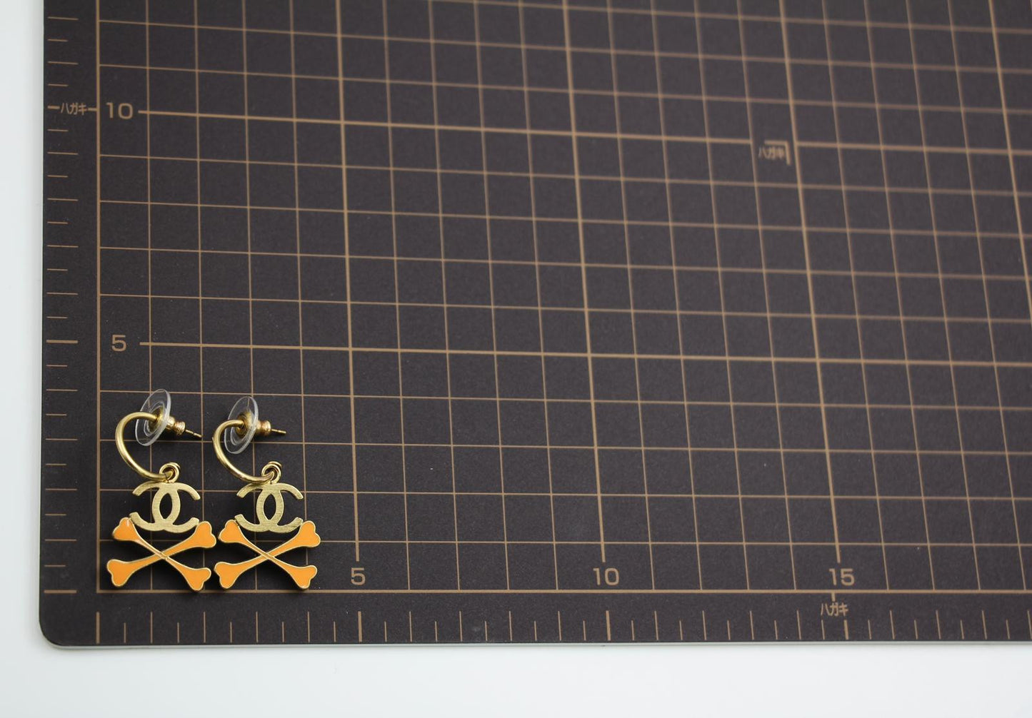 Chanel Vintage 03P Enamel Skull Orange Earrings