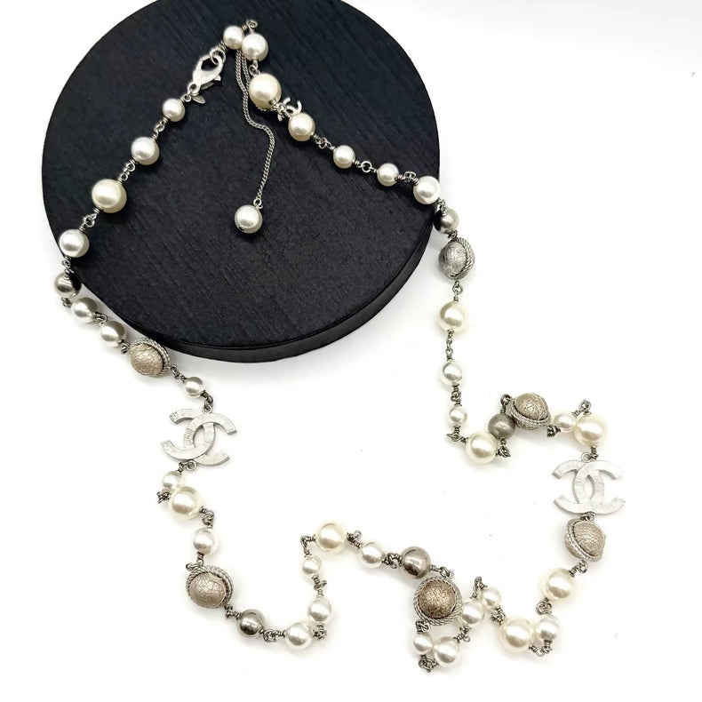 Chanel striped double C beaded long necklace