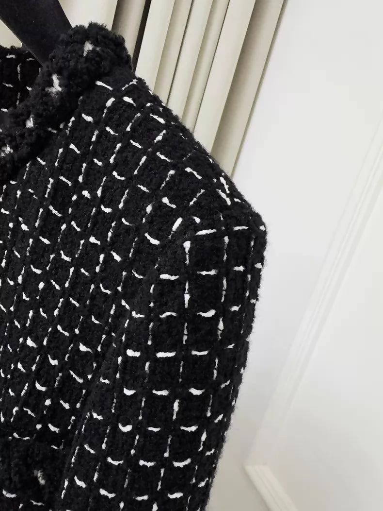 Chanel 23K black tweed jacket with white stitching