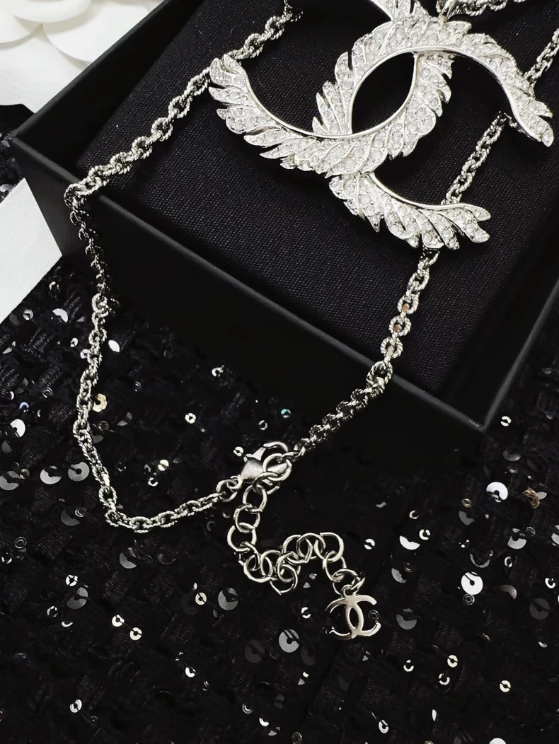 Chanel 25S double C logo feather