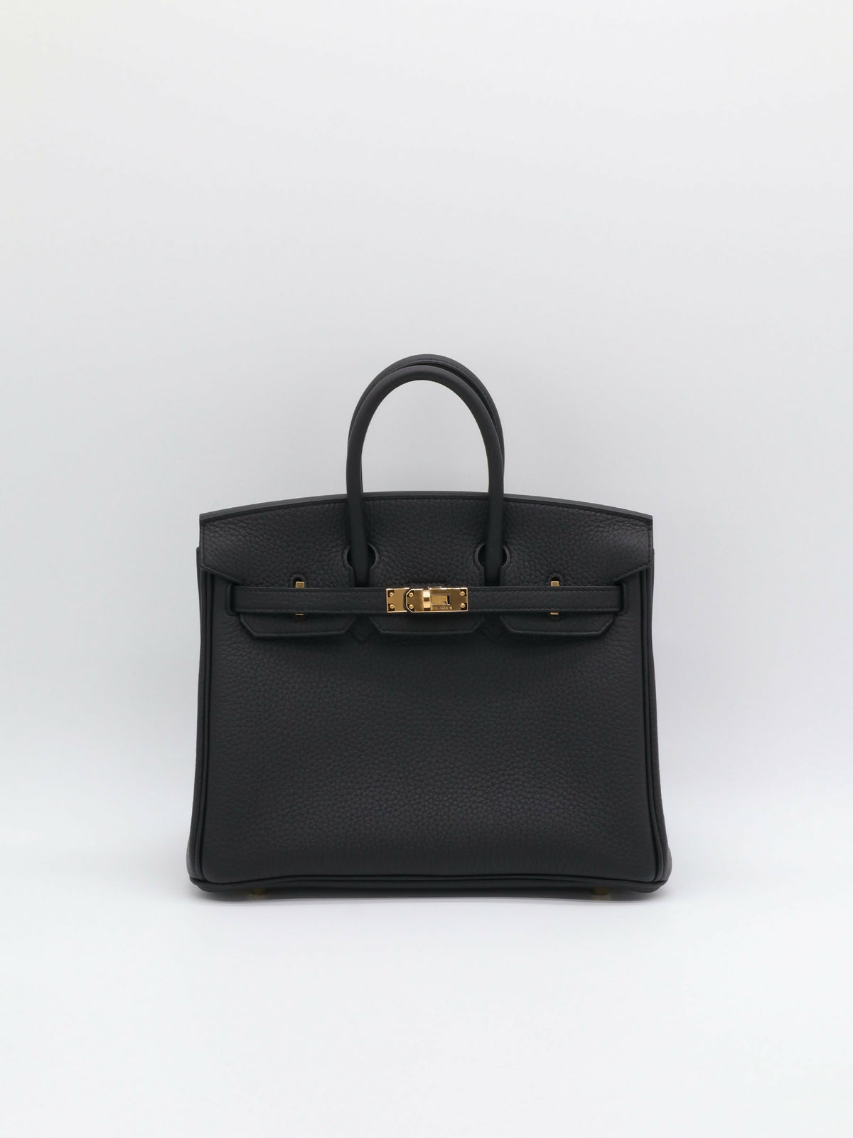 Hermès Birkin handbag in black grained leather with gold-tone turn-lock hardware and two rolled top handles