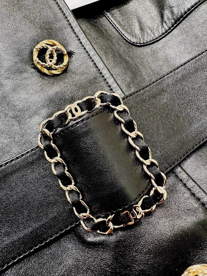 Chanel 2025 black leather vest dress with belt and chain