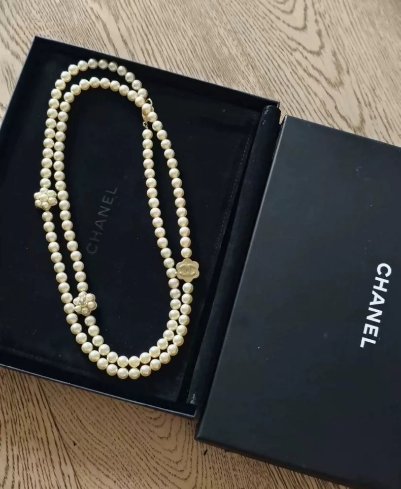 Chanel's multi-layered pearl floral design exudes elegance and sophistication