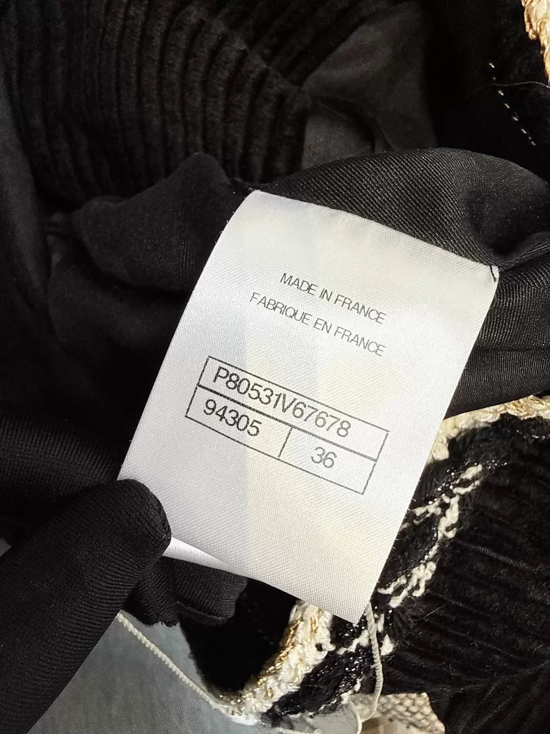 Chanel 25k black tweed jacket with gold-button trim
