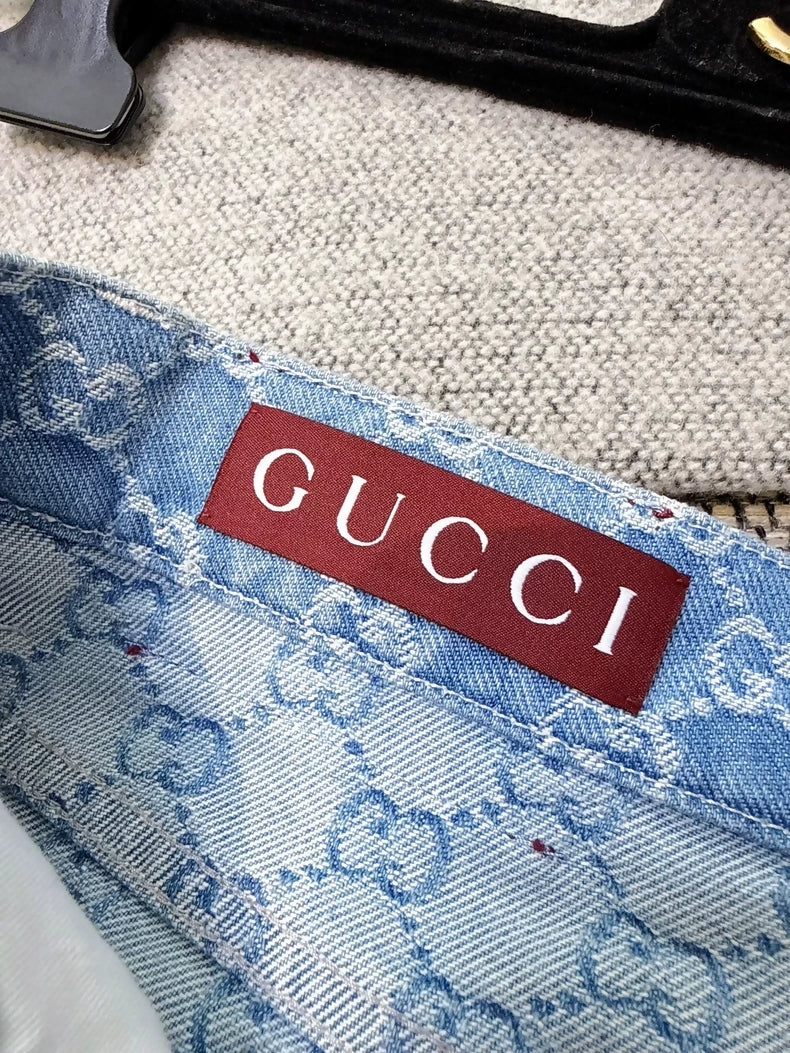 Gucci light blue logo all-over denim shorts