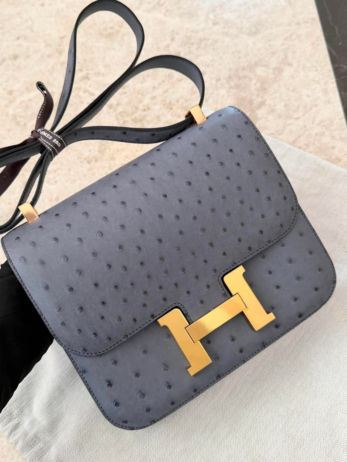 Hermes Constance 24 Verso Gris Agate / Paon Ostrich Gold hardware