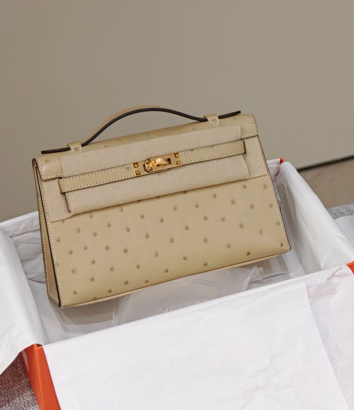 Hermes Kelly pochette trench ostrich gold hardware