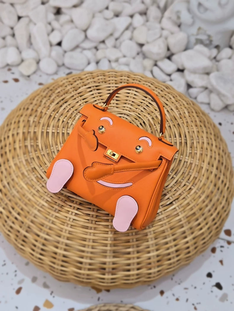 Hermès Kelly Doll orange, Sakura pink, Swift leather gold hardware