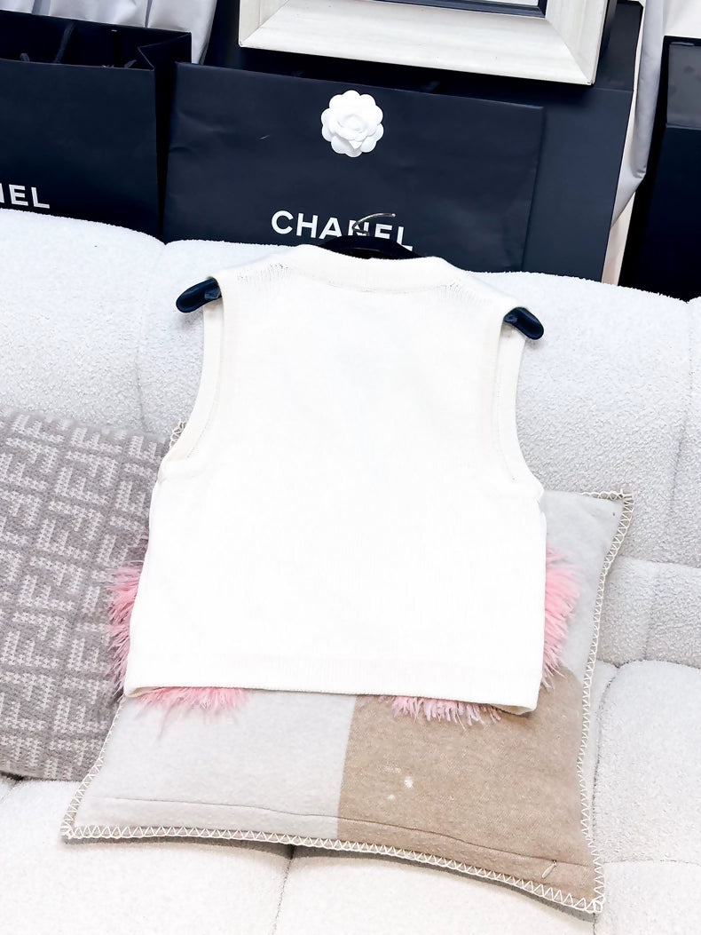 Chanel Fall/Winter 2023, white cashmere vest with pink ostrich feather