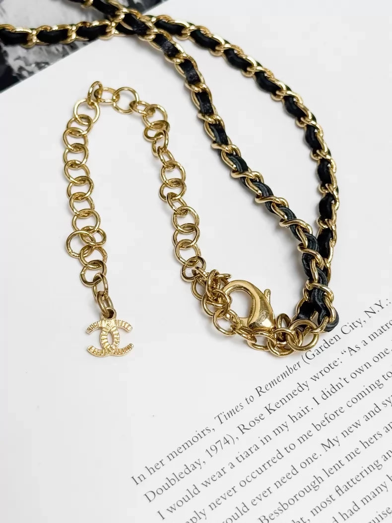 Chanel 22A black and gold bow leather chain choker necklace