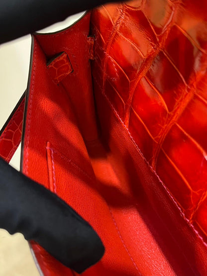Hermes Kelly cut red shiny crocodile leather gold hardware