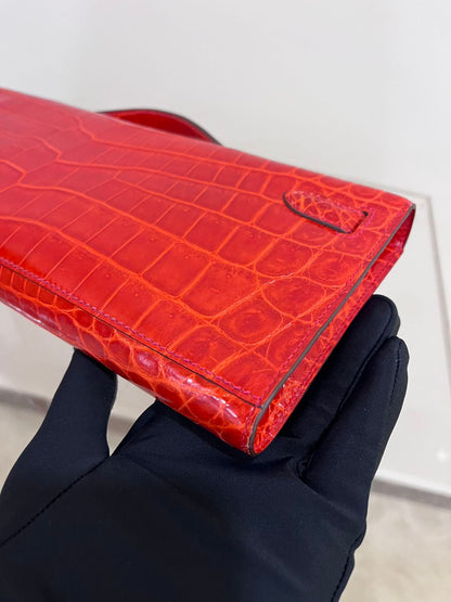 Hermes Kelly cut red shiny crocodile leather gold hardware