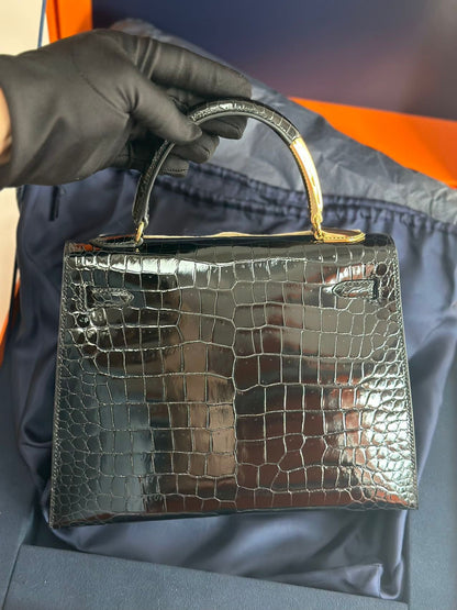 Hermès Kelly Midas 25 Noir Shiny Crocodile Porosus 18k yellow gold hardware & handle
