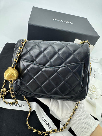 Chanel black mini flap bag with gold hardware