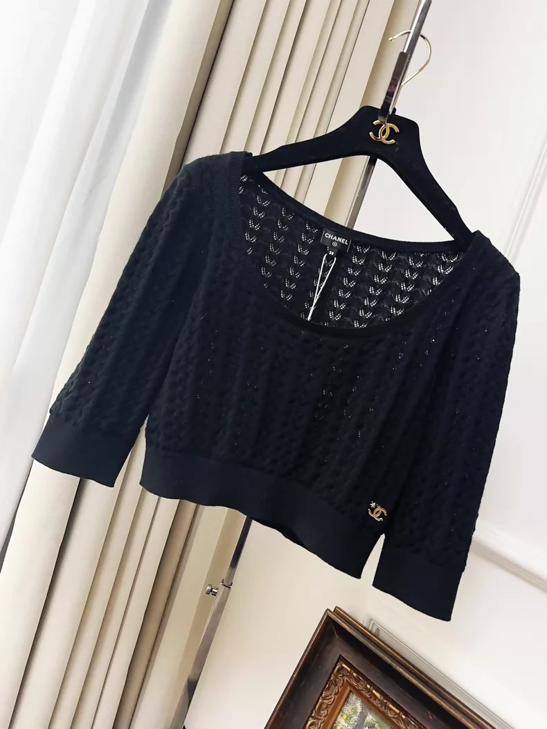 Chanel 24b black floral knit top with a large neckline