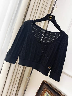 Chanel 24b black floral knit top with a large neckline