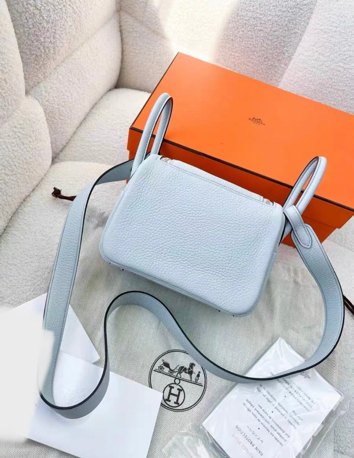 HERMÈS Mini Lindy shoulder bag in Bleu Pale Taurillon Clemence leather with Palladium hardware