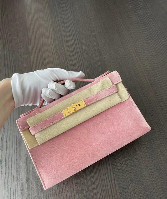 Hermès Kelly Pochette Pink Veau Doblis Suede with Gold Hardware