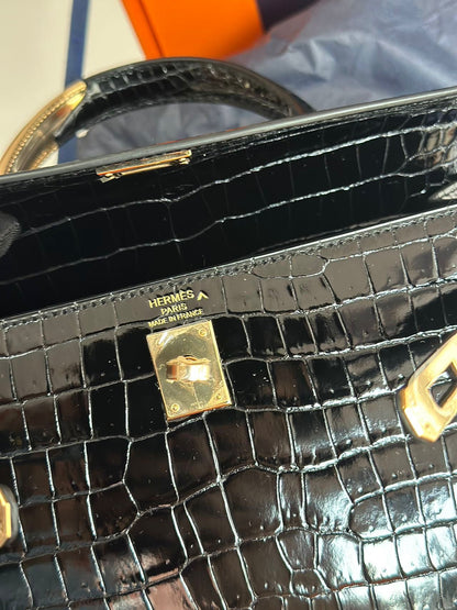 Hermès Kelly Midas 25 Noir Shiny Crocodile Porosus 18k yellow gold hardware & handle