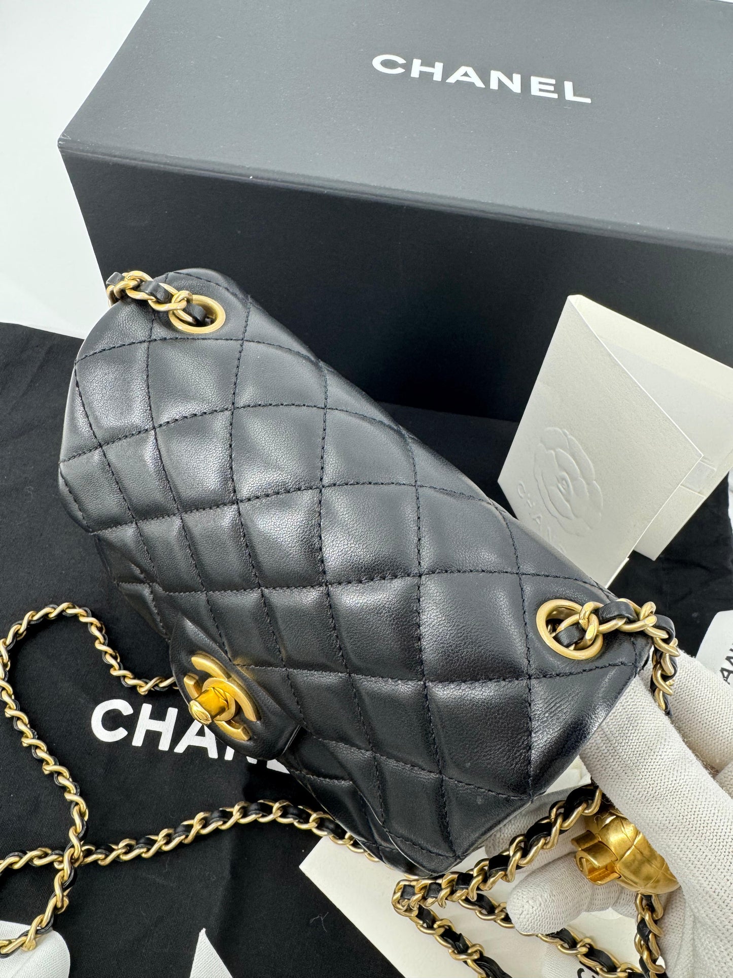 Chanel black mini flap bag with gold hardware