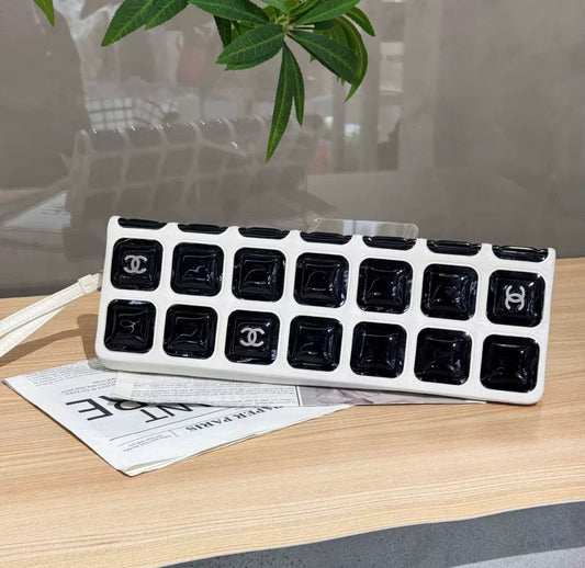 Chanel black and white patent leather clutch bag