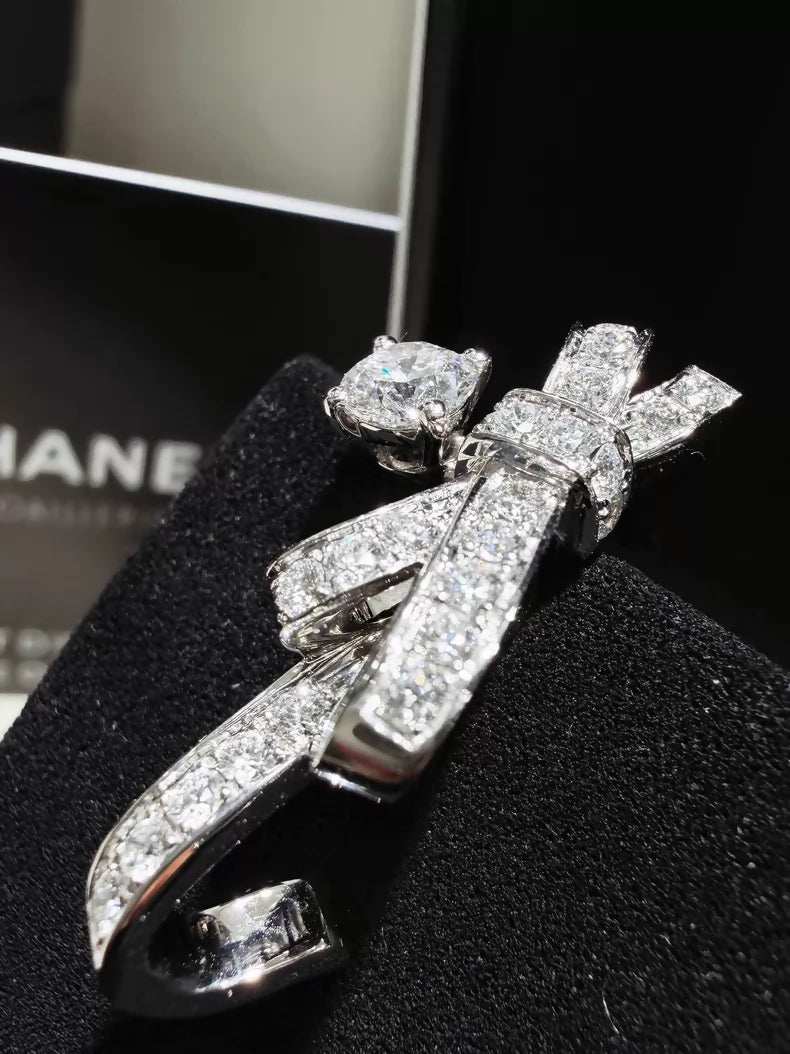 CHANEL earrings, white gold, full diamond bow, c