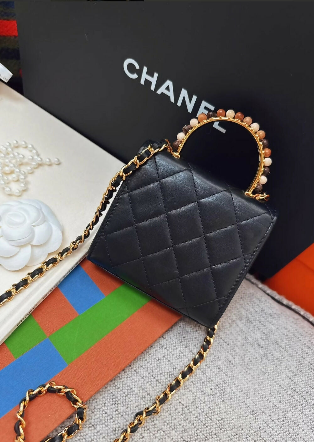 Chanel 23a Black Leather mini bag with gold top handle – Wararni.com