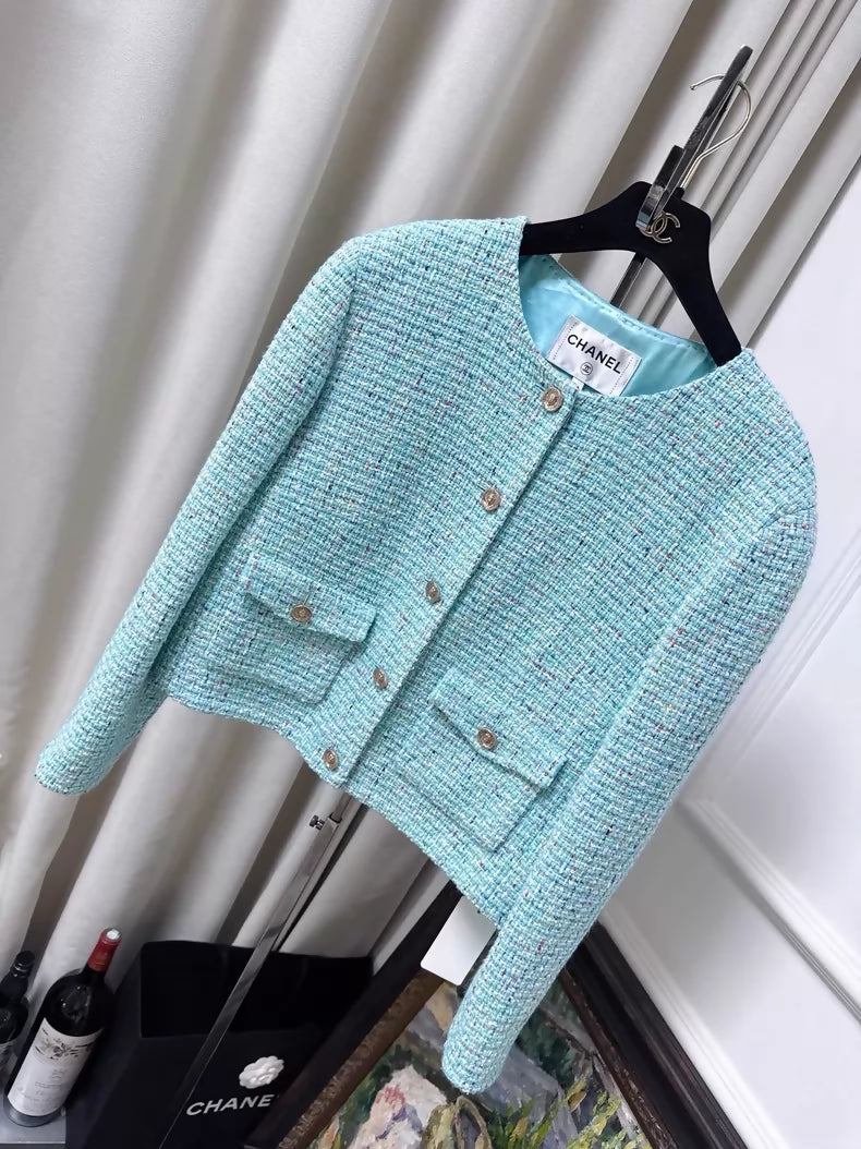 Chanel 25A light blue tweed jacket with gold lion buttons