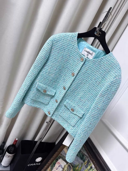 Chanel 25A light blue tweed jacket with gold lion buttons