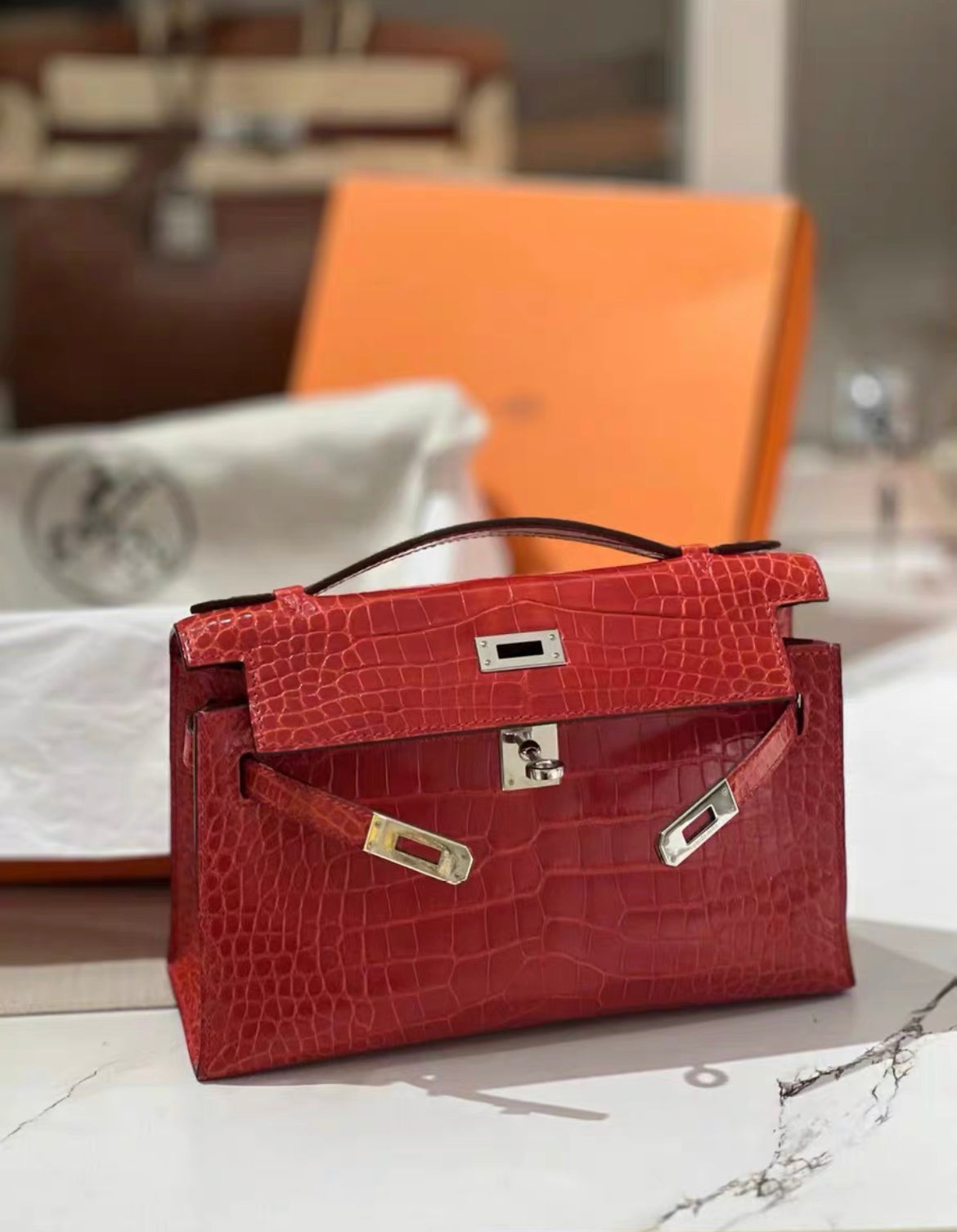 Hermès Kelly Pochette Red Shiny Alligator Palladium Hardware