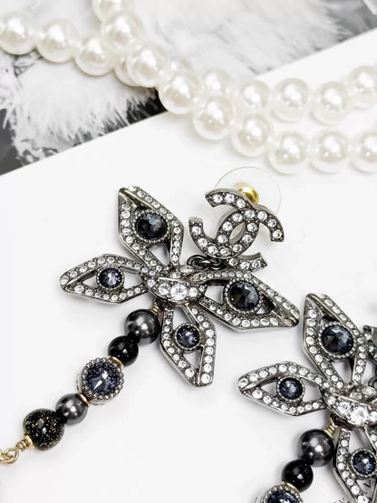 Chanel Métiers d'Art silver butterfly long stud earrings