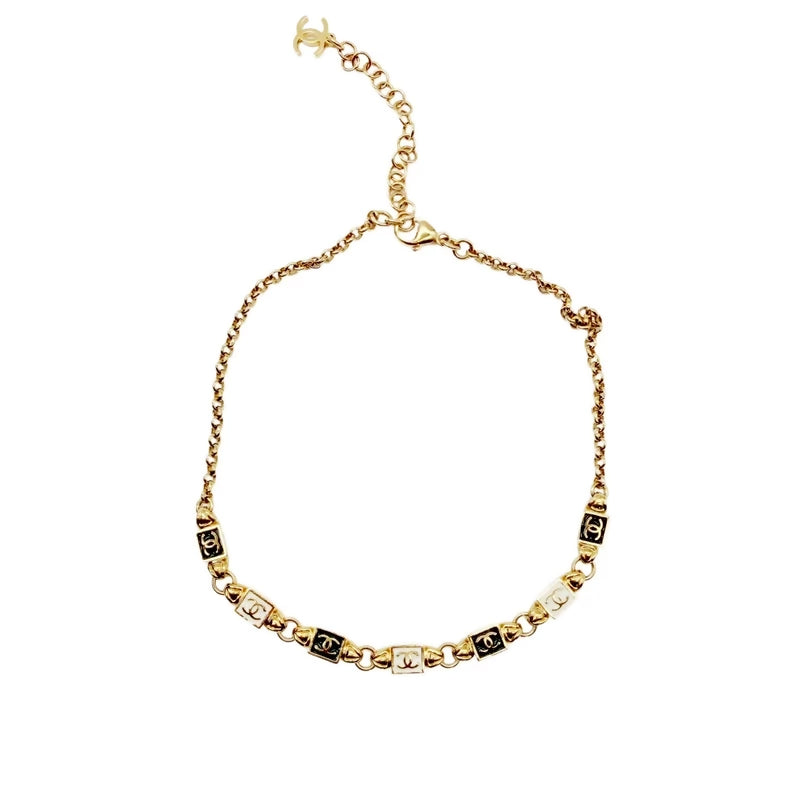 CHANEL black and white enamel square patchwork