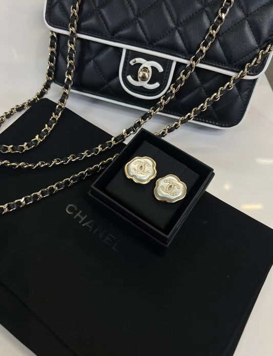 Chanel 25A mother-of-pearl cloud earrings